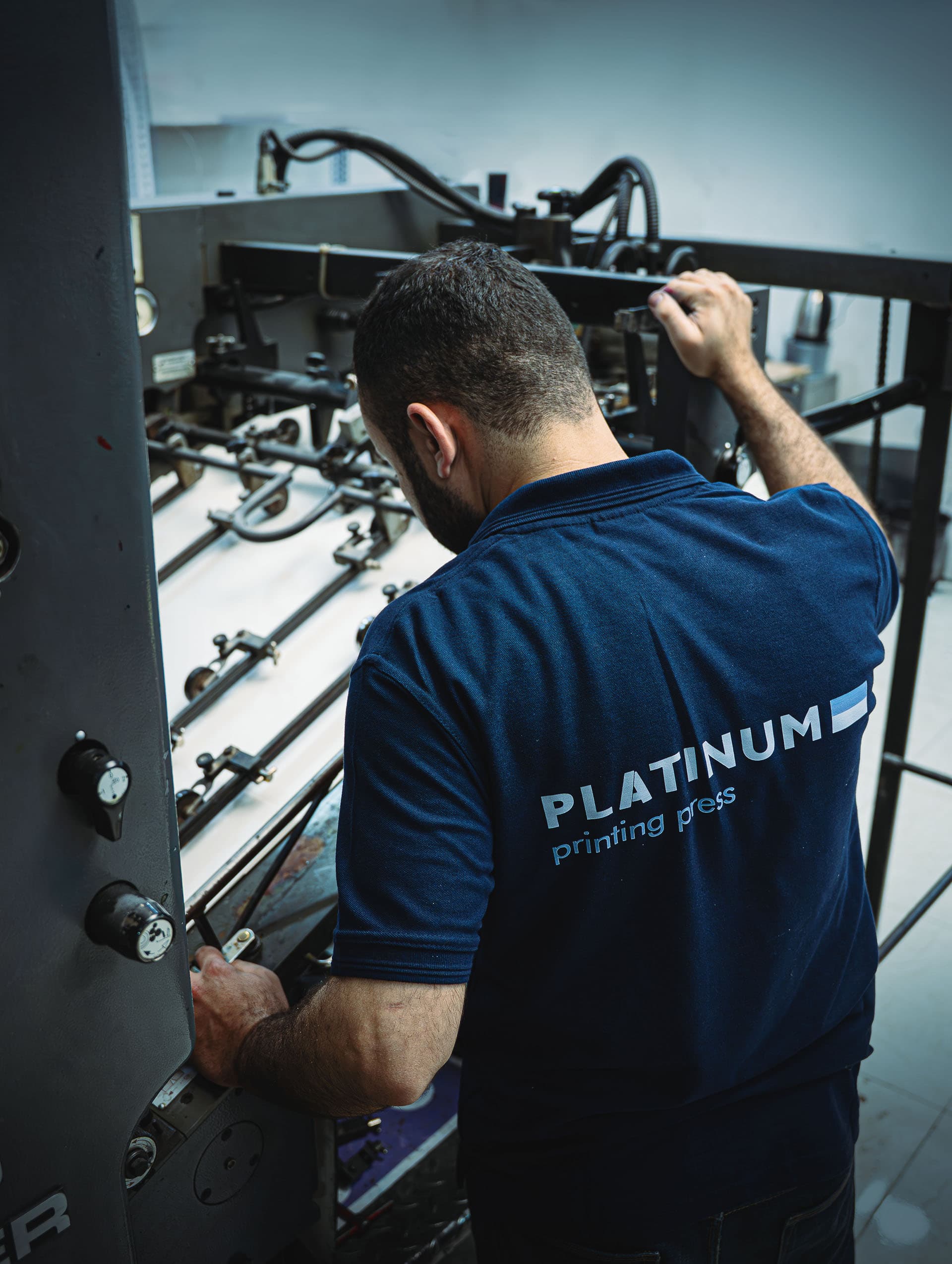 Hands checking quality of printed materials
